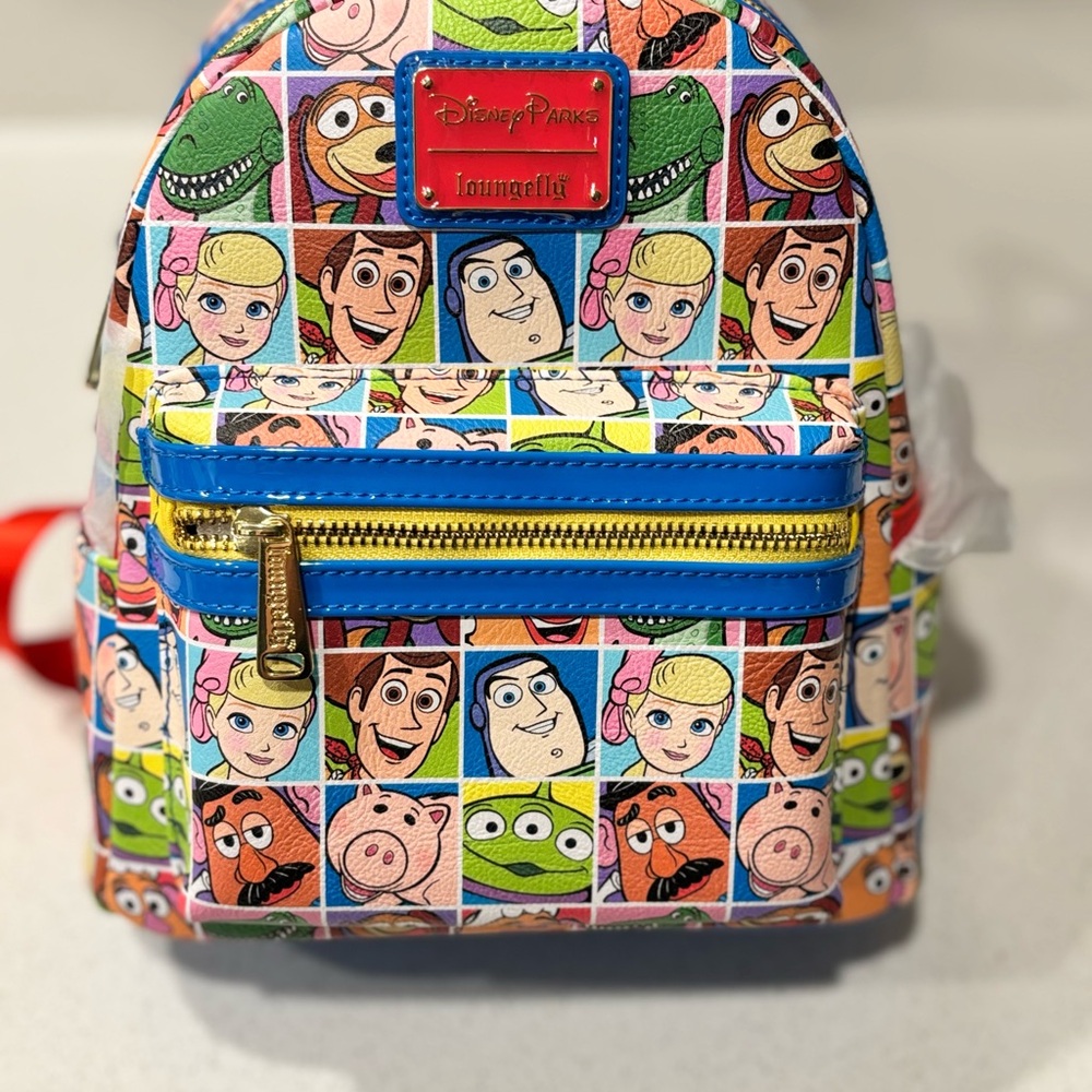 Loungefly Disney Parks Toy Story Character
Squares AOP Mini Backpack